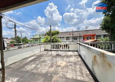 Outdoor patio with a view of neighboring buildings