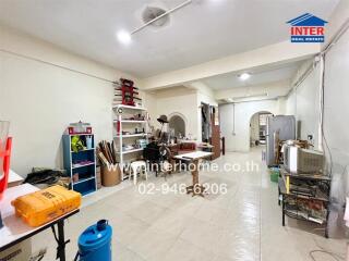 Spacious main living area with various furnishings and storage