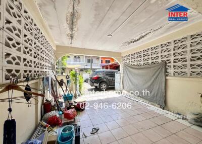 Garage with storage space and parked car