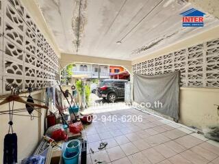 Garage with storage space and parked car