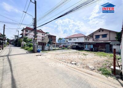 Street view with residential buildings and power lines