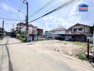 Street view with residential buildings and power lines