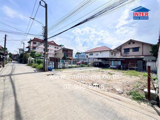 Street view with residential buildings and power lines