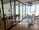 Modern office conference room with large windows and glass partitions