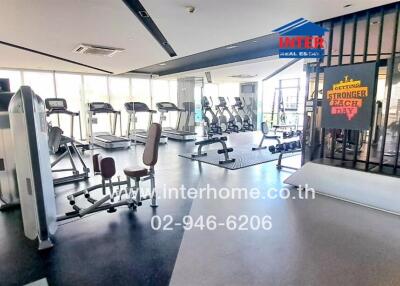 Modern gym facility with fitness equipment and motivational posters