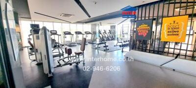 Modern gym facility with fitness equipment and motivational posters