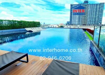 Luxury rooftop infinity pool with view of cityscape.