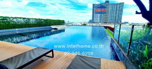 Luxury rooftop infinity pool with view of cityscape.