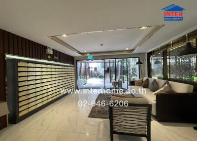 Lobby area with mailboxes and seating