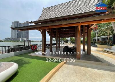 Covered outdoor seating area with a waterfront view