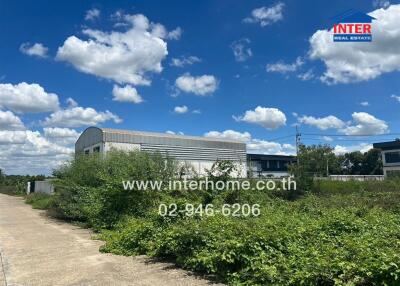 Building with surrounding greenery and blue sky