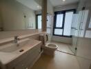 Modern bathroom with large mirror and shower area