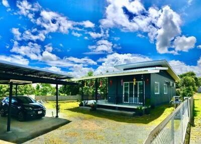 Exterior view of a house with a carport and driveway