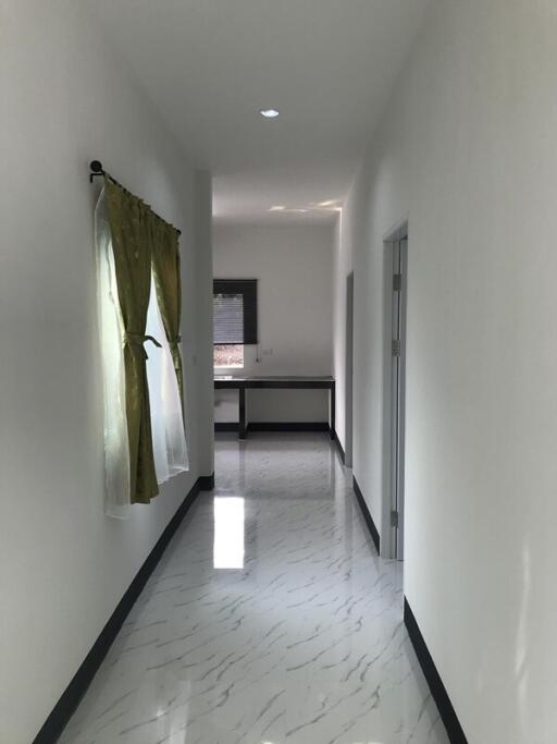 Bright and clean hallway with marble flooring