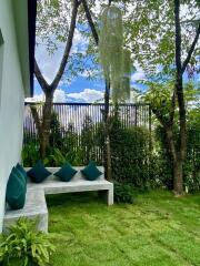 Well-kept garden area with concrete seating