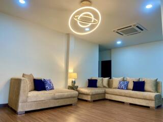 Modern living room with stylish lighting and comfortable seating