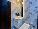 Modern bathroom with marble tiles, stylish lighting, and a bidet