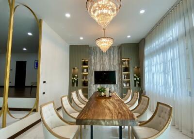 Luxury dining room with elegant chandelier and modern furniture