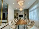 Luxury dining room with elegant chandelier and modern furniture