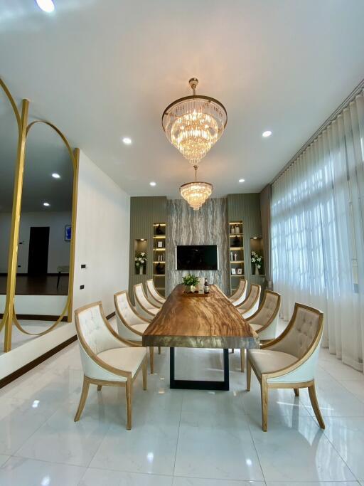 Luxury dining room with elegant chandelier and modern furniture