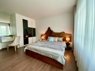 Bedroom with modern decor and wooden accents