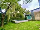 Modern garden with pool and lush greenery