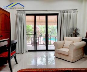 Bright living room with large window and garden view