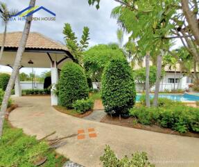 Outdoor garden area with pathway and gazebo