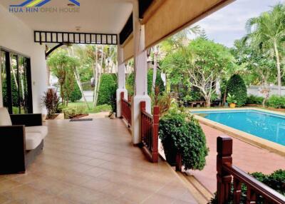 Spacious backyard with pool and covered patio