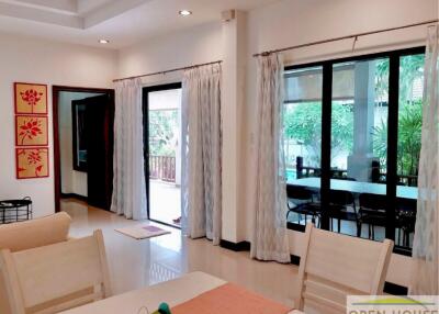 Spacious living room with large windows and a view of the garden