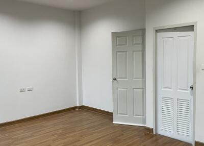 Interior room with wooden floor and white walls