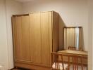 Bedroom with wooden wardrobe and dressing table