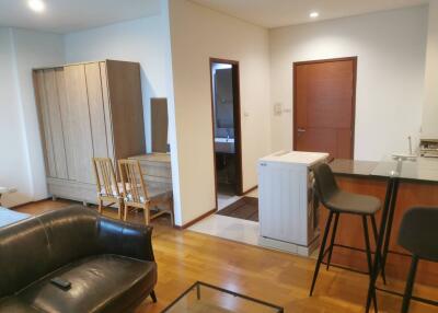 Living area with kitchen and washing machine