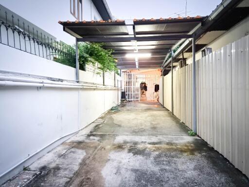 Covered driveway with gated entrance