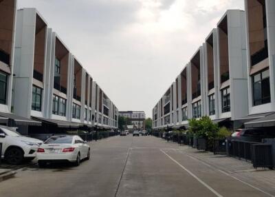 Row of modern townhouses with carports