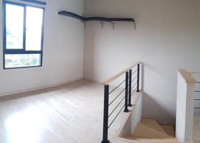 Open space with staircase and window