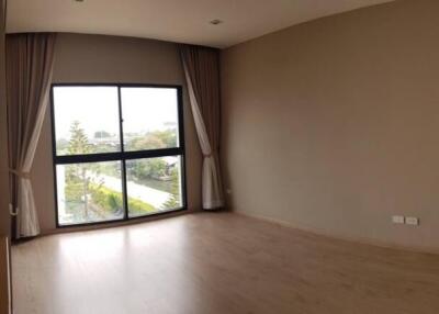 Spacious living room with large window