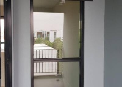 narrow window with black frame, balcony