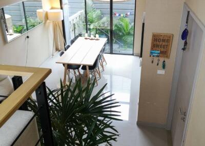 Modern living space with dining area and plants