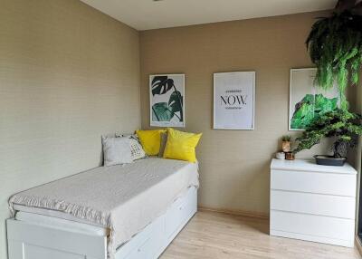 Bedroom with a daybed and wall art