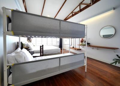 Spacious bedroom with bunk beds and a double bed