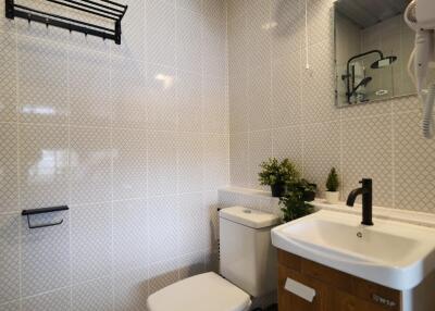 Bathroom with wall-mounted fan and modern fixtures