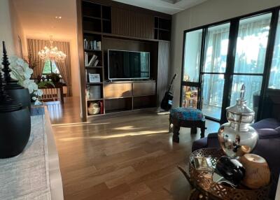 Elegant living room with modern furnishings and a balcony view