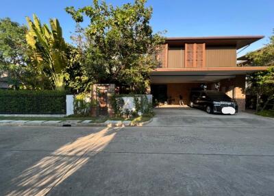 Front view of a modern house with car parked in driveway