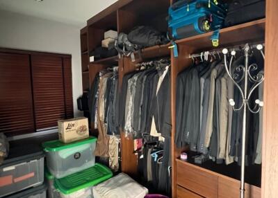 Spacious walk-in closet with organized shelving and storage