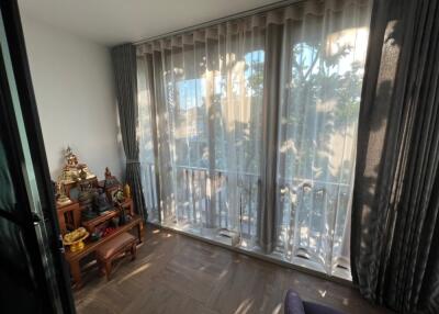 Living room with large windows and decorative items