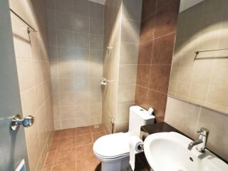 Modern bathroom with tiled walls and floor