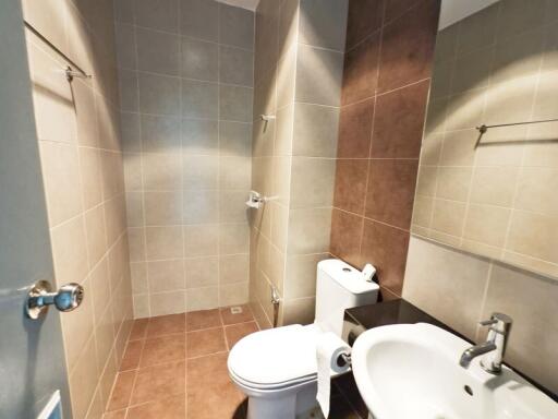 Modern bathroom with tiled walls and floor