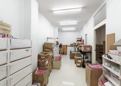 A storage room filled with boxes and shelves.