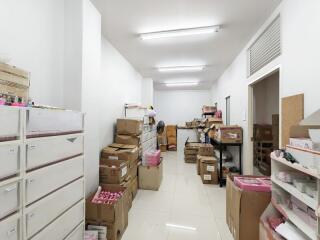 A storage room filled with boxes and shelves.